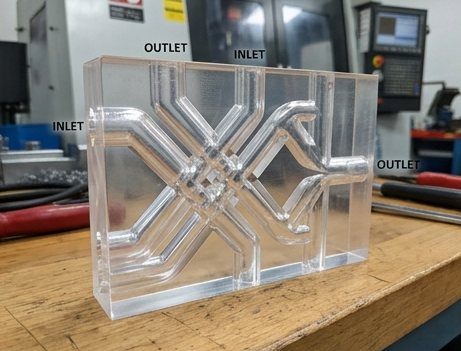 Transparent machined manifold block with intersecting internal channels